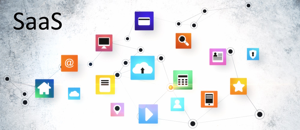 Photo showing computer icons and the word SaaS.