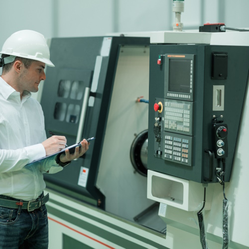 Photo of machinery and work to represent manufacturing industry.