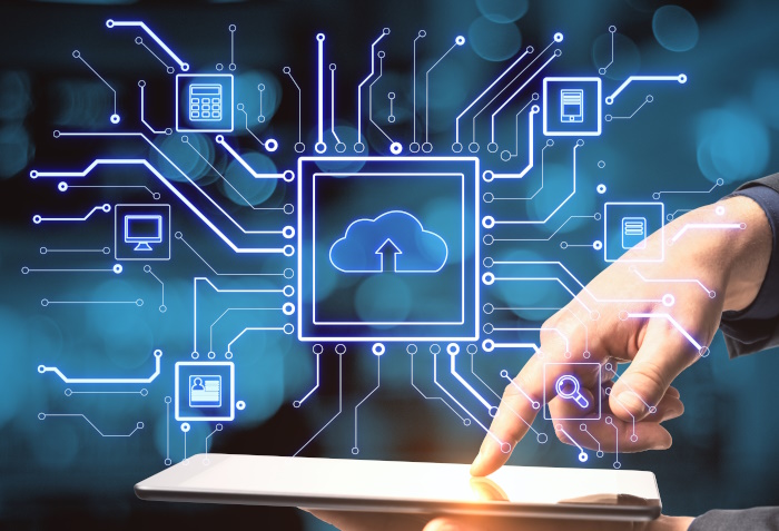 Photo of a document under an overlay of a cloud and computer icons, to represent managed cloud service providers.